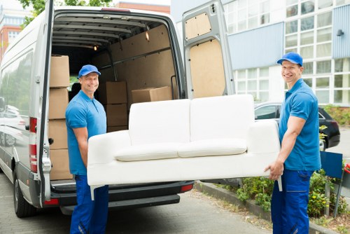 Home moving service in Barbican with packed boxes and removal van planning