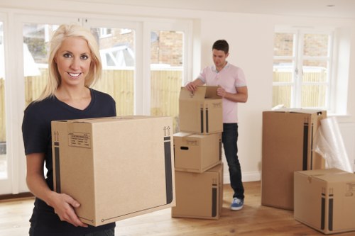 Packed moving boxes and furniture for a Barbican relocation