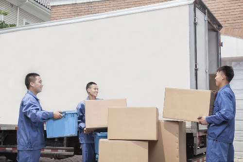 Loading household items in a Barbican street move