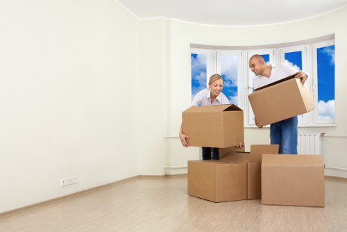 Packed boxes and furniture being loaded for a Barbican home or office move