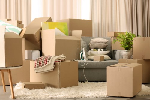 Trained removal staff carrying items carefully in a Barbican property