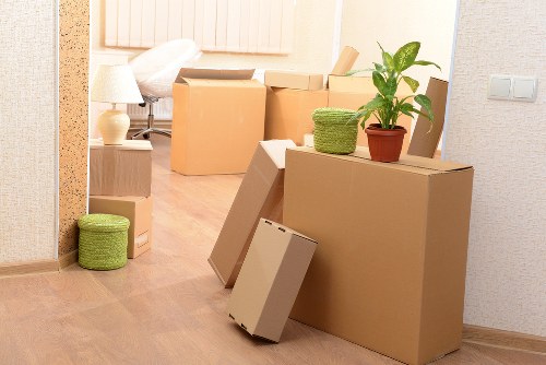 Loading furniture into a moving truck in Barbican